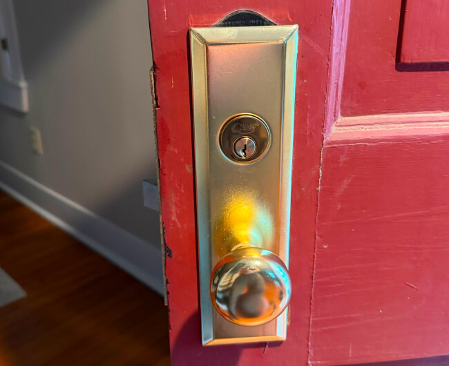 Brass entry lock on a home front door in Fort Worth