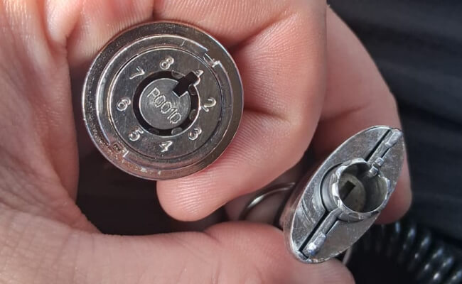 Car ignition cylinder held during ignition repair in Waco