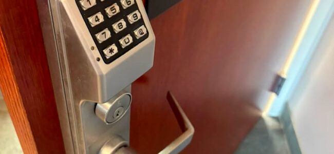 Commercial keypad access control lock on a College Station door