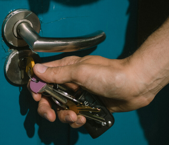 Locksmith opening a storefront door in Fort Worth