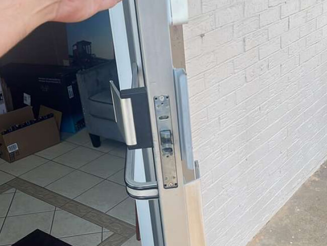 Locksmith with keys at a door in Fort Worth