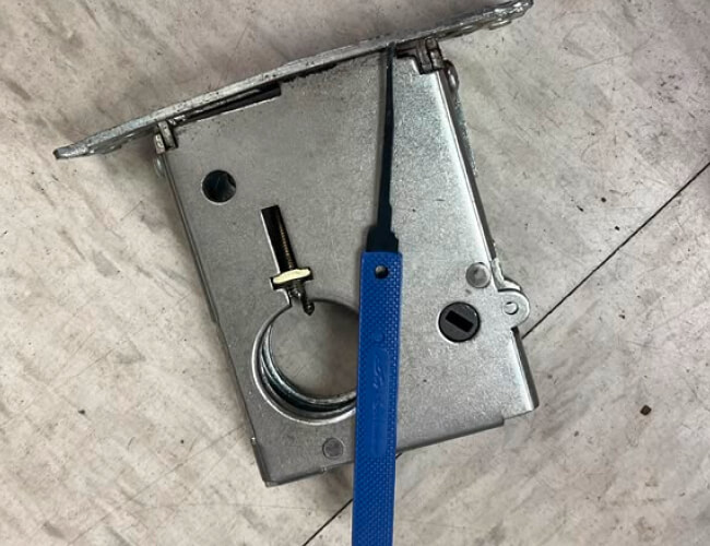 Mortise lock and locksmith tool at an emergency job in Temple