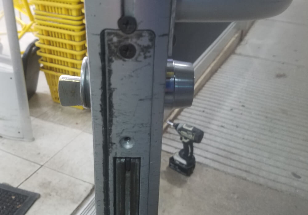 Storefront door lock bolt and key cylinder